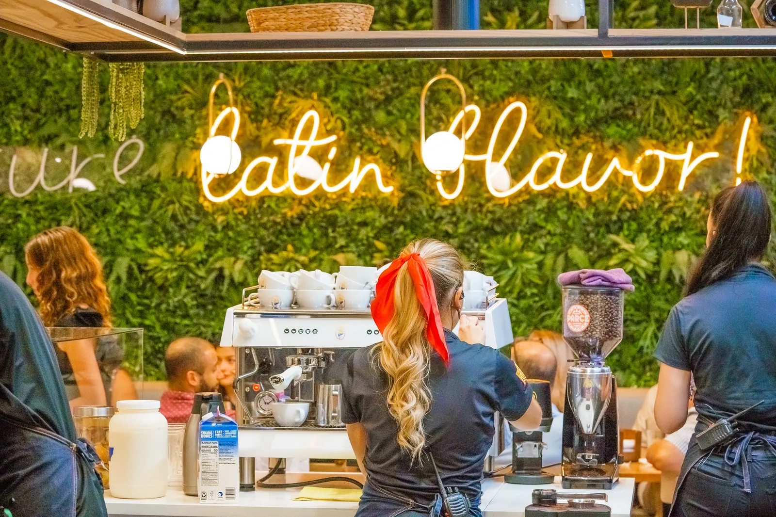Coffee bar with the Pure Latin Flavor neon sign